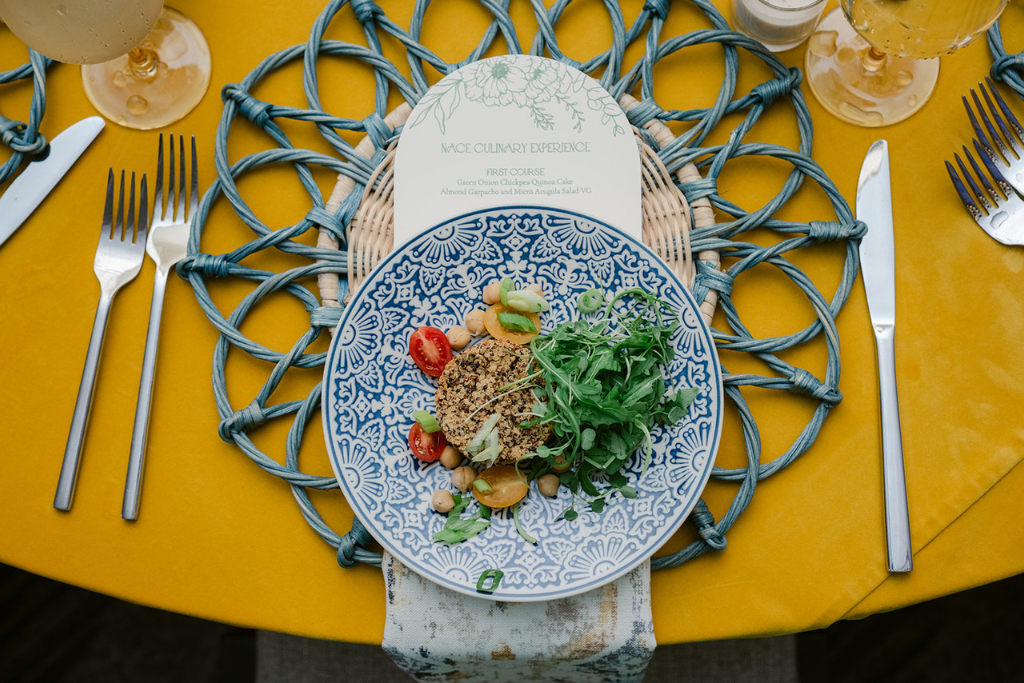 vibrant yellow and blue table setting at NACE Culinary Experience 2024