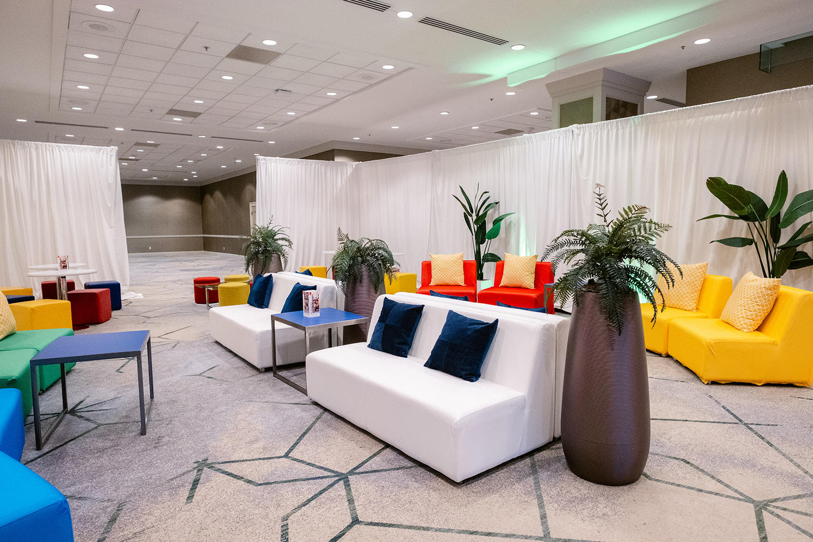 Modern Colorful couches and pillows in CORT Lounge at 2024 NACE Experience Conference